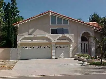 Two story home with garage after addition