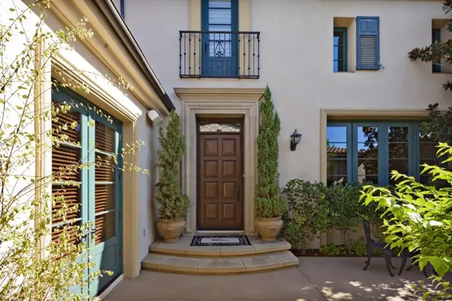Home exterior with arched entry