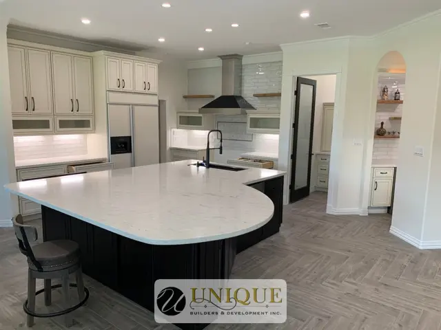 White kitchen with large island