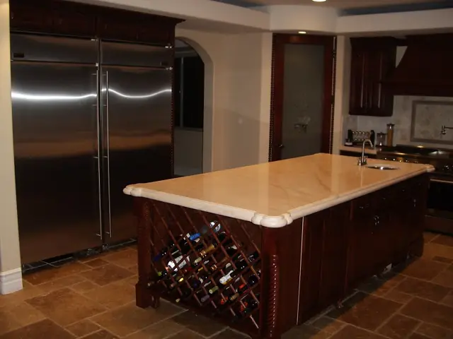 Kitchen island with dark base cabinets
